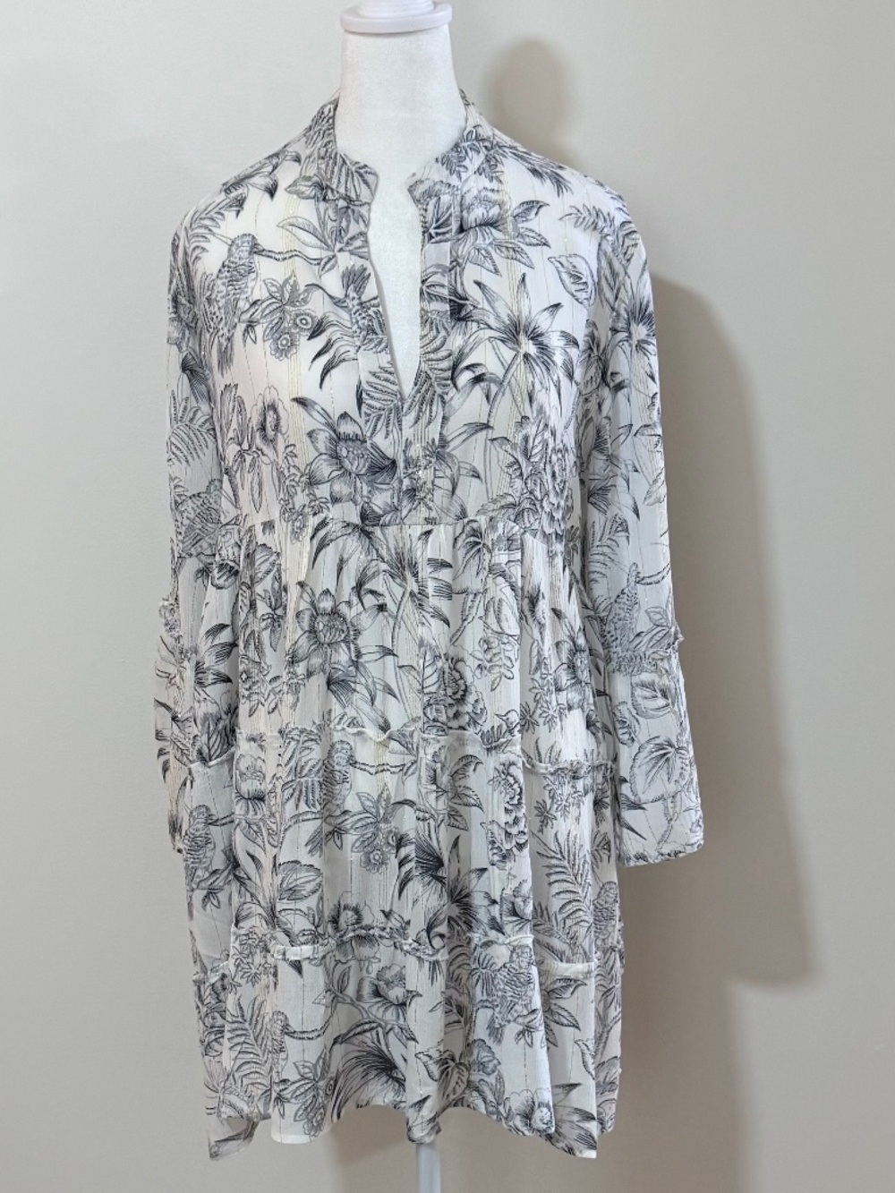 So so pretty tunic style dress with flutter sleeves.